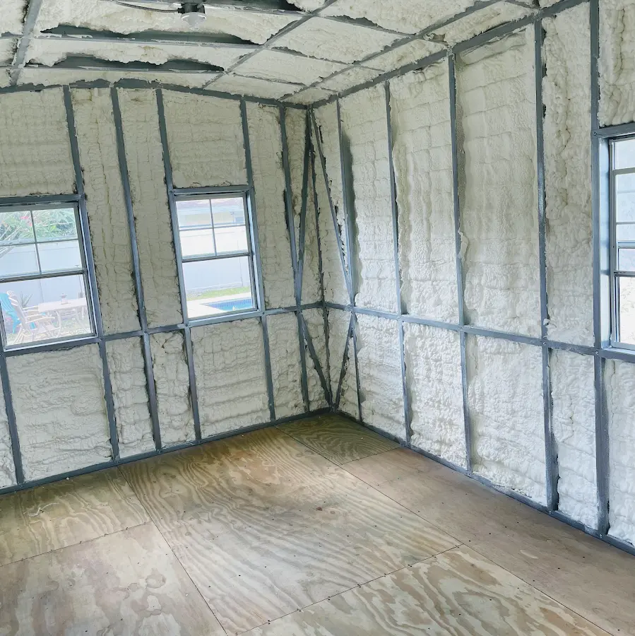 Closed-cell spray foam insulation applied to wall cavities in a residential project in Arlington
